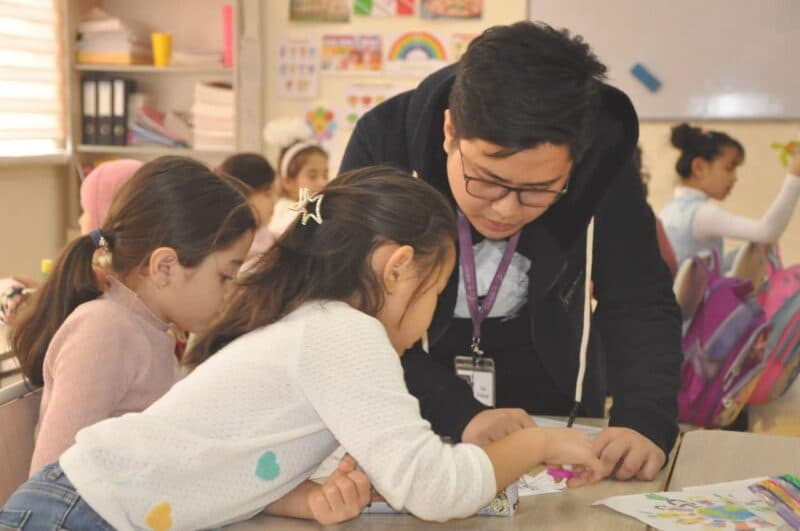 Teacher with students